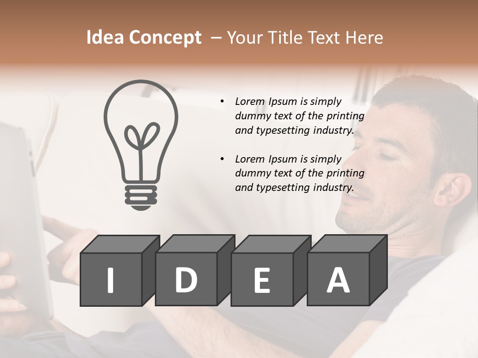 A Man Sitting On A Couch Looking At A Tablet PowerPoint Template