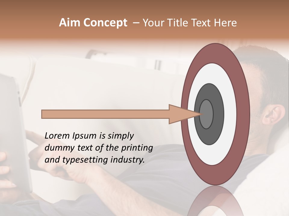 A Man Sitting On A Couch Looking At A Tablet PowerPoint Template