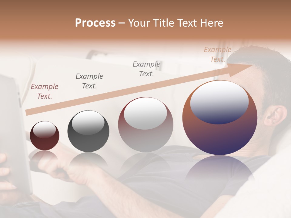 A Man Sitting On A Couch Looking At A Tablet PowerPoint Template