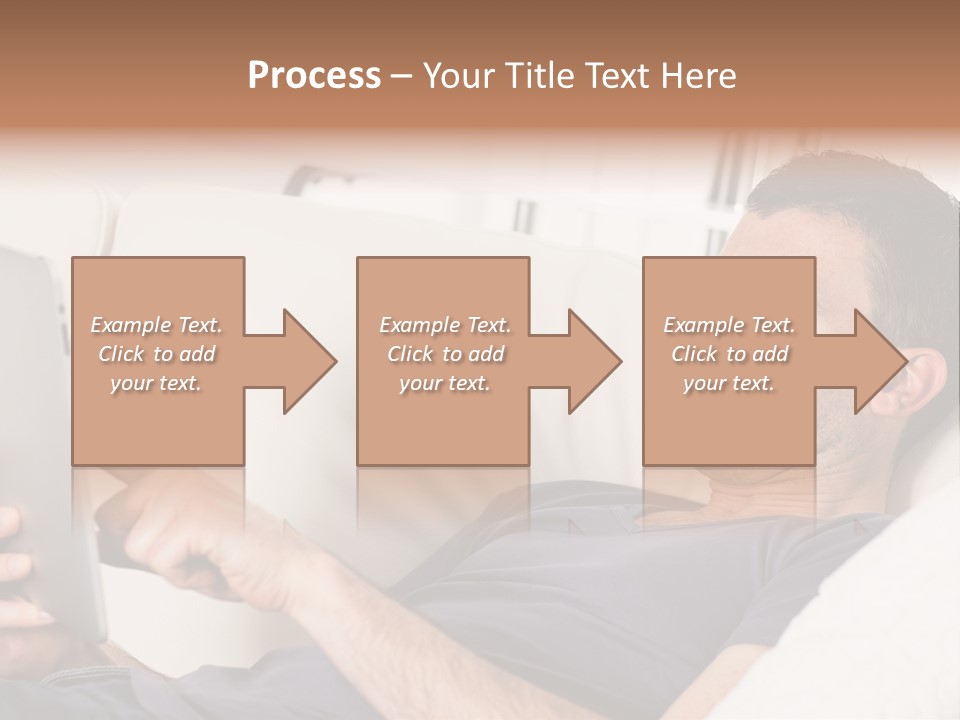 A Man Sitting On A Couch Looking At A Tablet PowerPoint Template