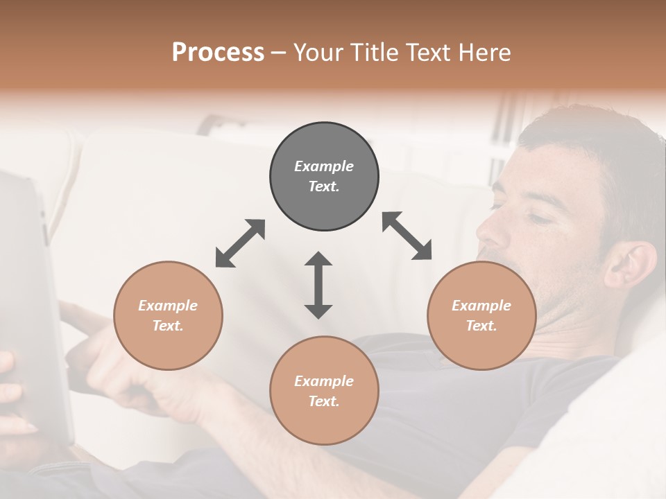 A Man Sitting On A Couch Looking At A Tablet PowerPoint Template