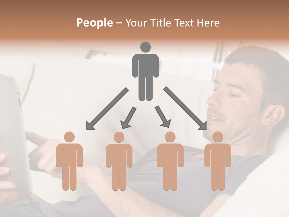 A Man Sitting On A Couch Looking At A Tablet PowerPoint Template