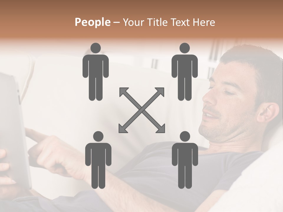 A Man Sitting On A Couch Looking At A Tablet PowerPoint Template