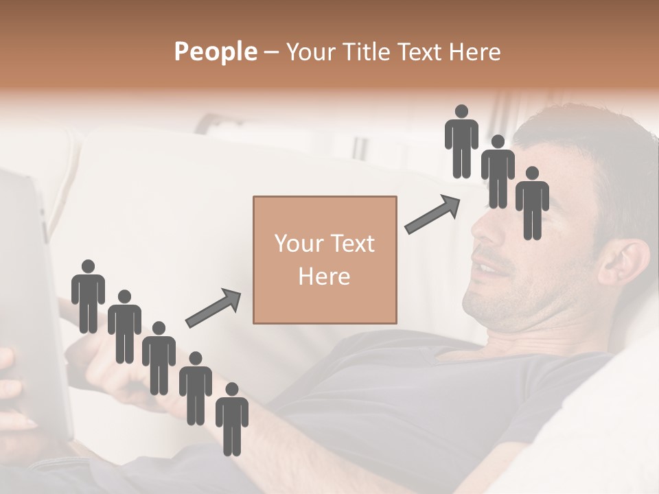 A Man Sitting On A Couch Looking At A Tablet PowerPoint Template