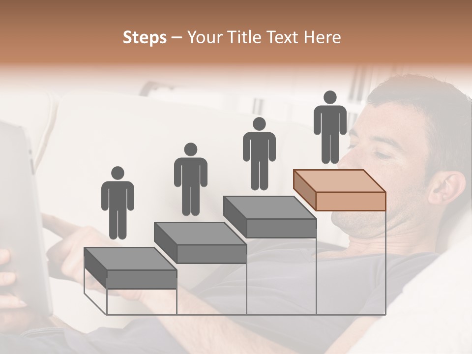 A Man Sitting On A Couch Looking At A Tablet PowerPoint Template