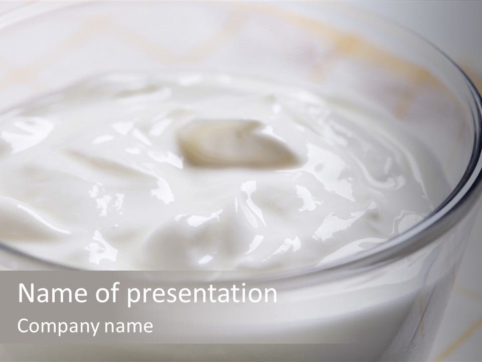 A Glass Of Yogurt With A Spoon In It PowerPoint Template
