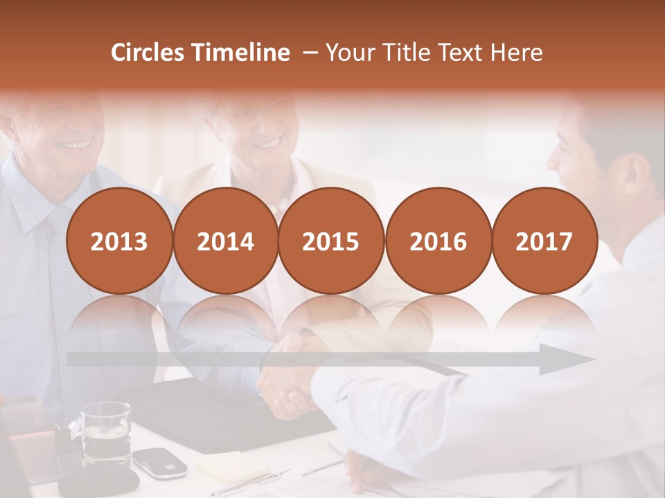 A Group Of People Shaking Hands At A Table PowerPoint Template