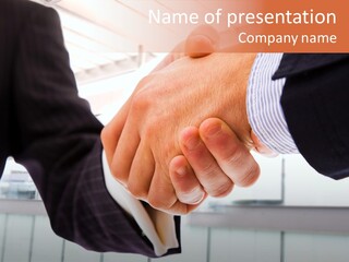 Two Men Shaking Hands Over A Piece Of Paper PowerPoint Template