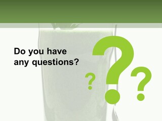 A Green Smoothie In A Glass With A Leaf On Top PowerPoint Template