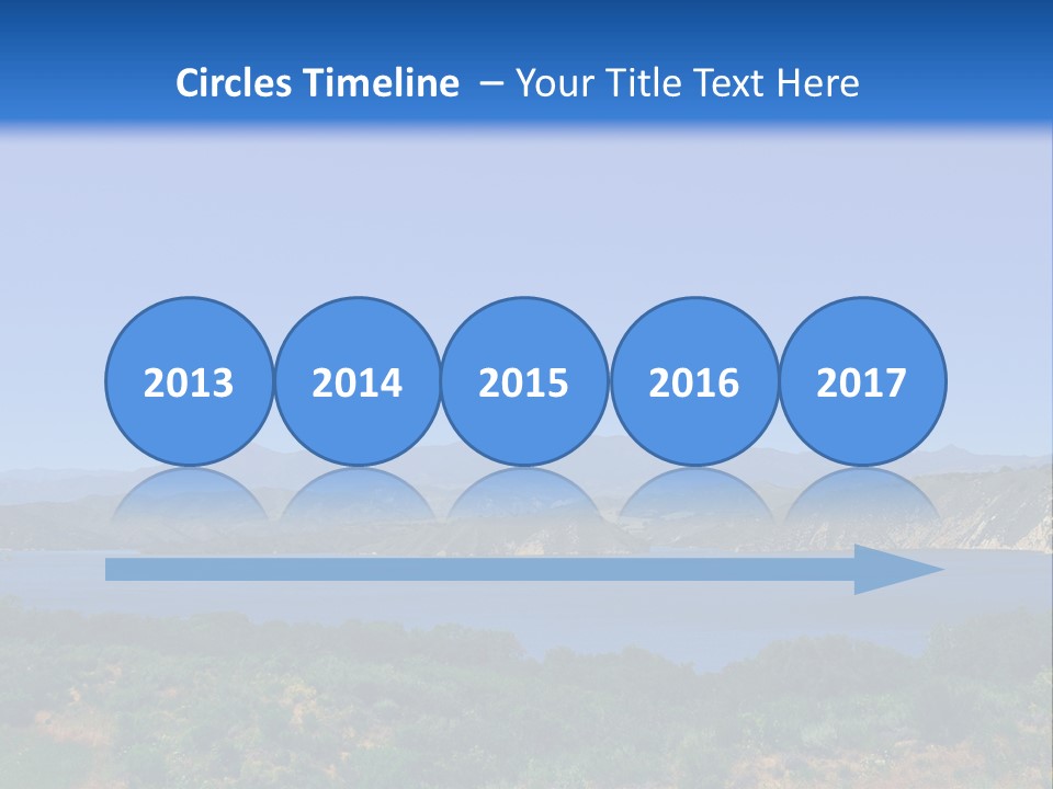 A Blue Lake With Mountains In The Background PowerPoint Template