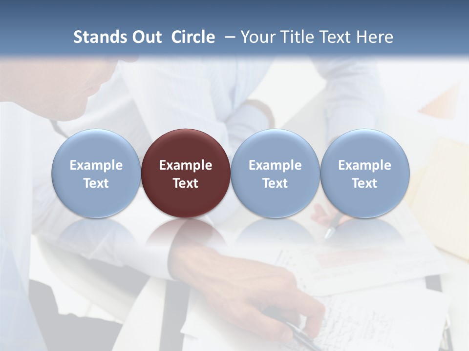 A Couple Of People Sitting At A Table With Papers PowerPoint Template