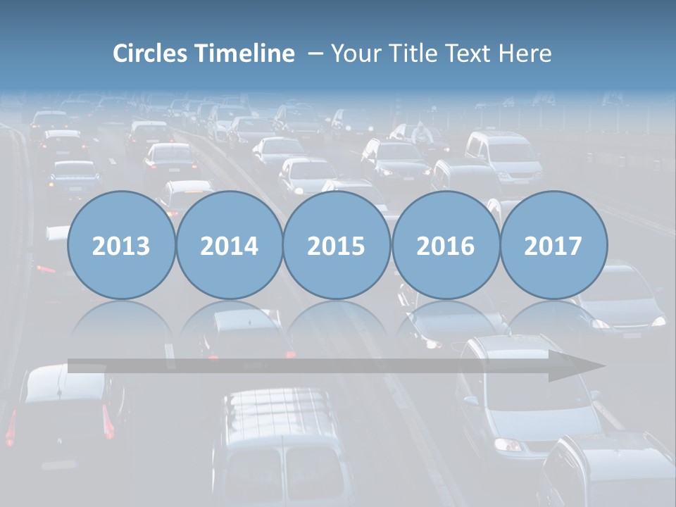 A Highway Filled With Lots Of Traffic Next To A Tall Building PowerPoint Template