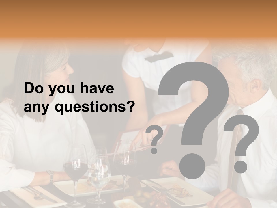 A Group Of People Sitting Around A Table PowerPoint Template