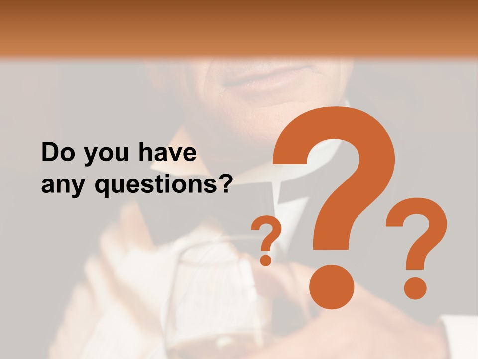 A Man In A Tuxedo Holding A Glass Of Wine PowerPoint Template