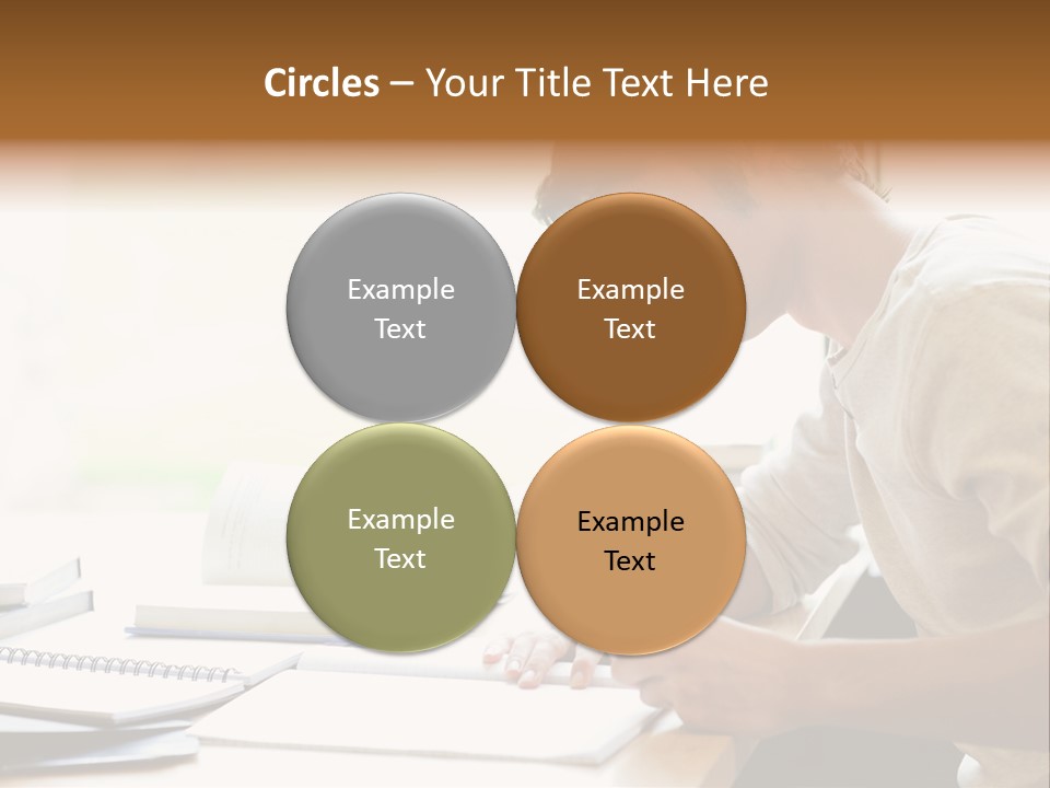 A Man Sitting At A Desk Writing On A Piece Of Paper PowerPoint Template