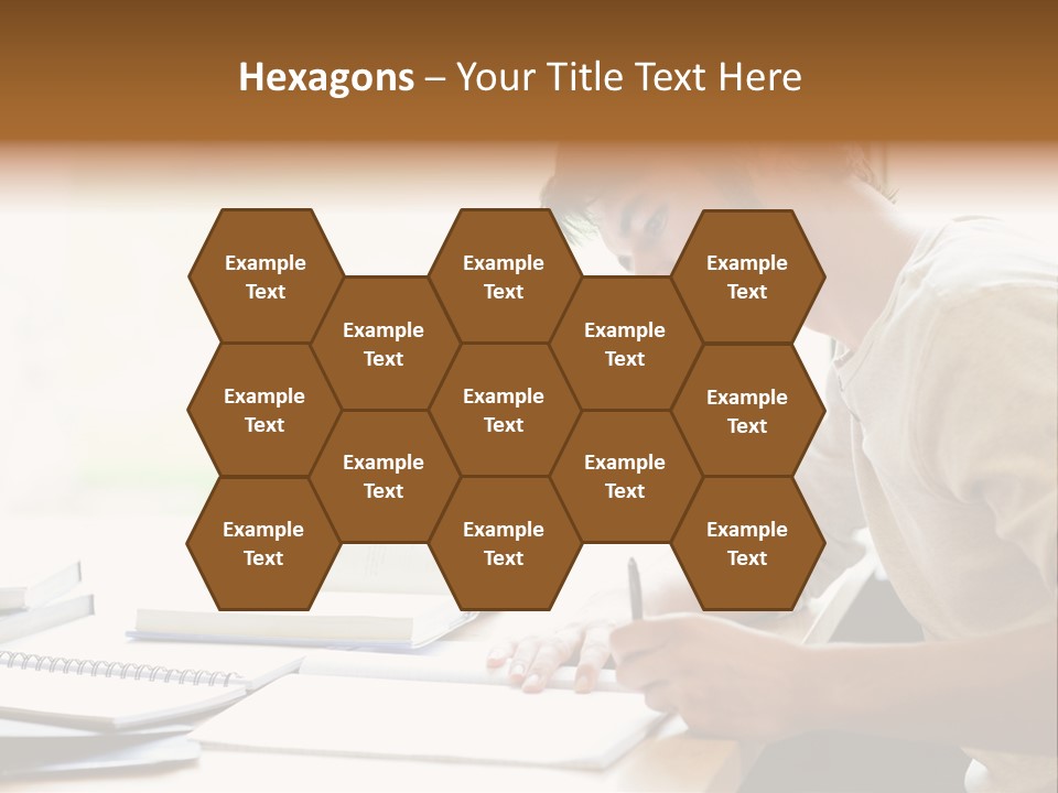 A Man Sitting At A Desk Writing On A Piece Of Paper PowerPoint Template