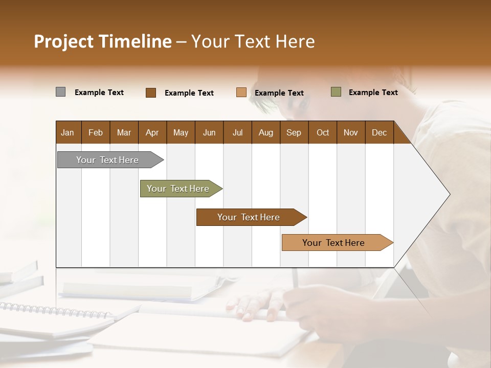 A Man Sitting At A Desk Writing On A Piece Of Paper PowerPoint Template