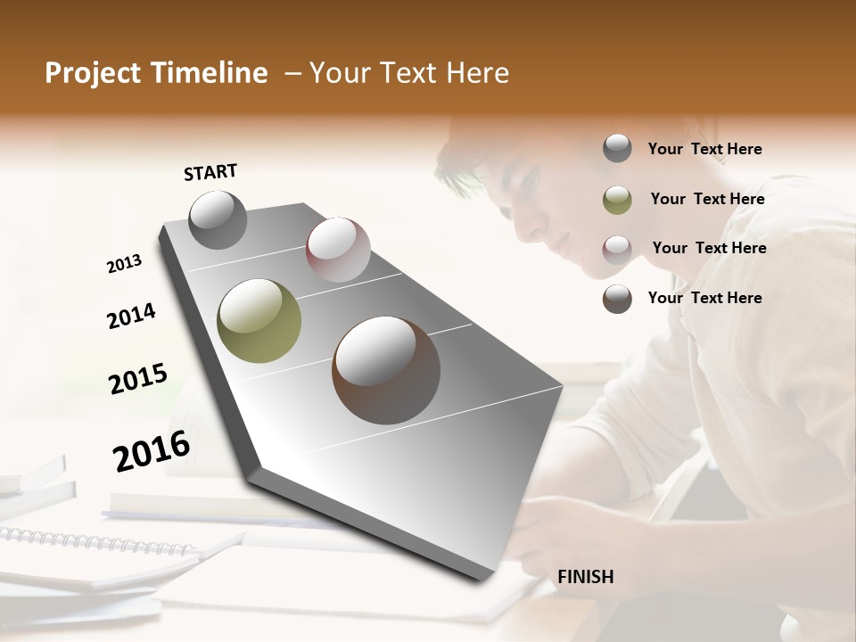 A Man Sitting At A Desk Writing On A Piece Of Paper PowerPoint Template