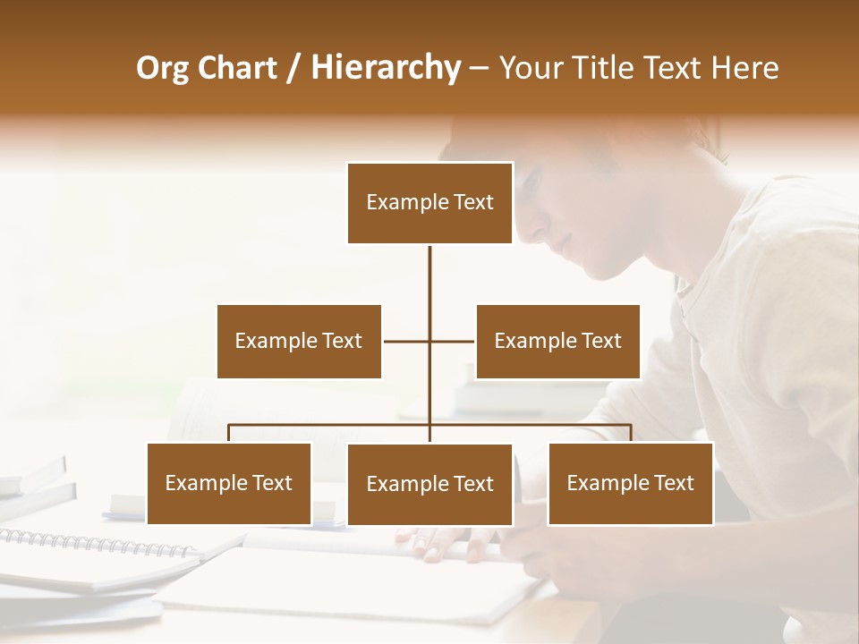 A Man Sitting At A Desk Writing On A Piece Of Paper PowerPoint Template