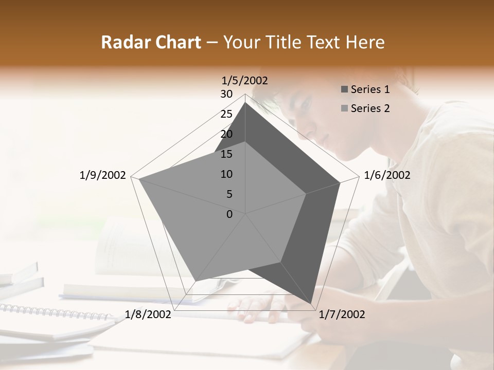 A Man Sitting At A Desk Writing On A Piece Of Paper PowerPoint Template