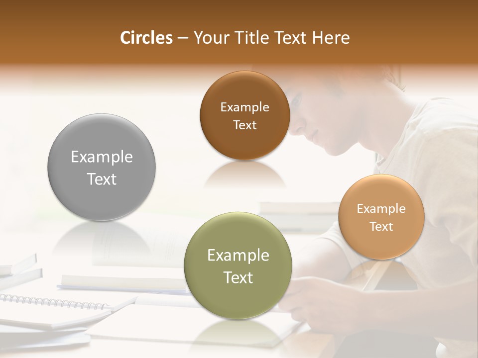 A Man Sitting At A Desk Writing On A Piece Of Paper PowerPoint Template