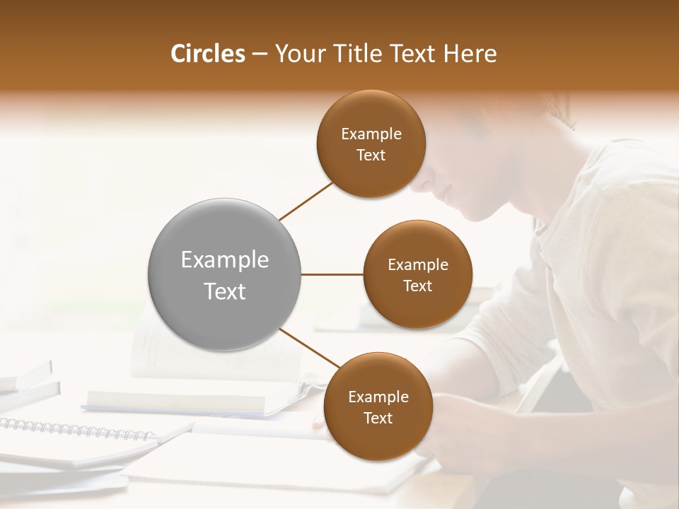 A Man Sitting At A Desk Writing On A Piece Of Paper PowerPoint Template