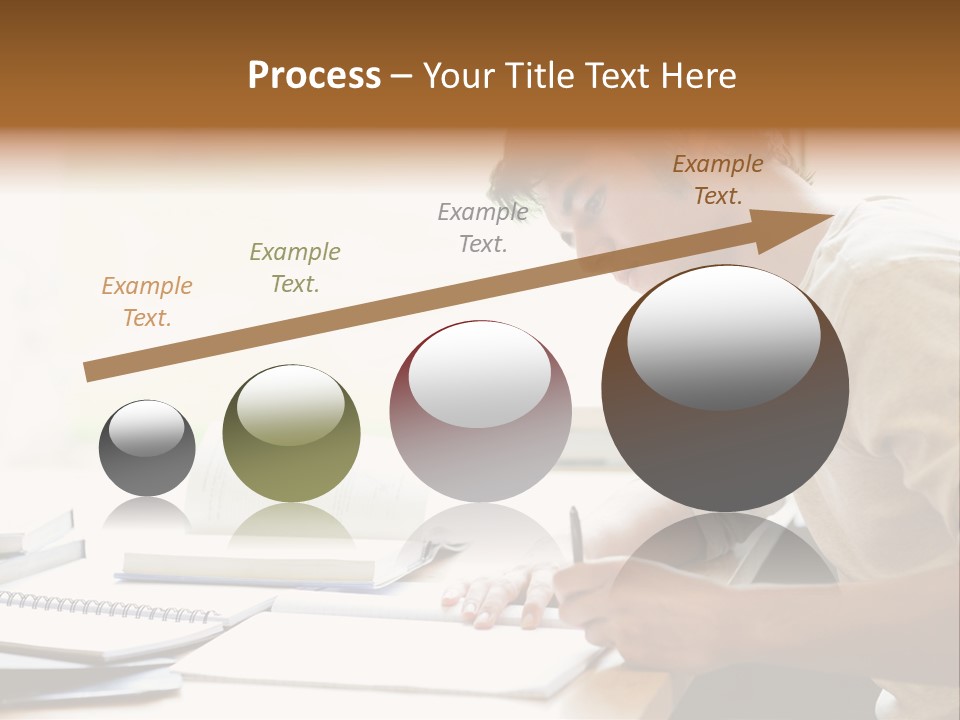 A Man Sitting At A Desk Writing On A Piece Of Paper PowerPoint Template