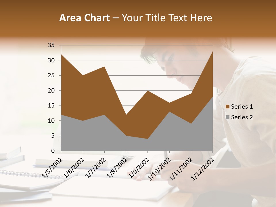 A Man Sitting At A Desk Writing On A Piece Of Paper PowerPoint Template