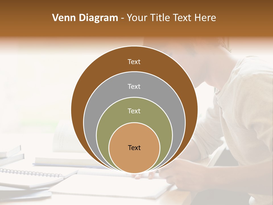 A Man Sitting At A Desk Writing On A Piece Of Paper PowerPoint Template