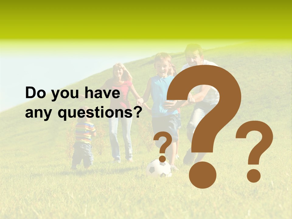 A Family Playing With A Soccer Ball In A Field PowerPoint Template