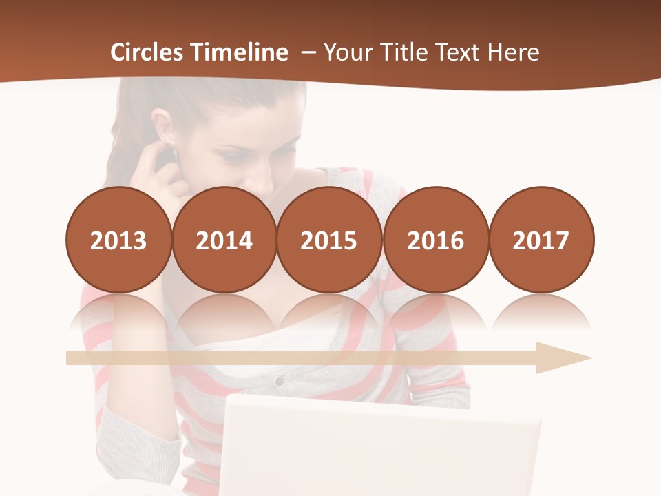 A Woman Sitting On The Floor Using A Laptop Computer PowerPoint Template