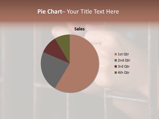 A Person's Hand Holding The Bars Of A Jail Cell PowerPoint Template