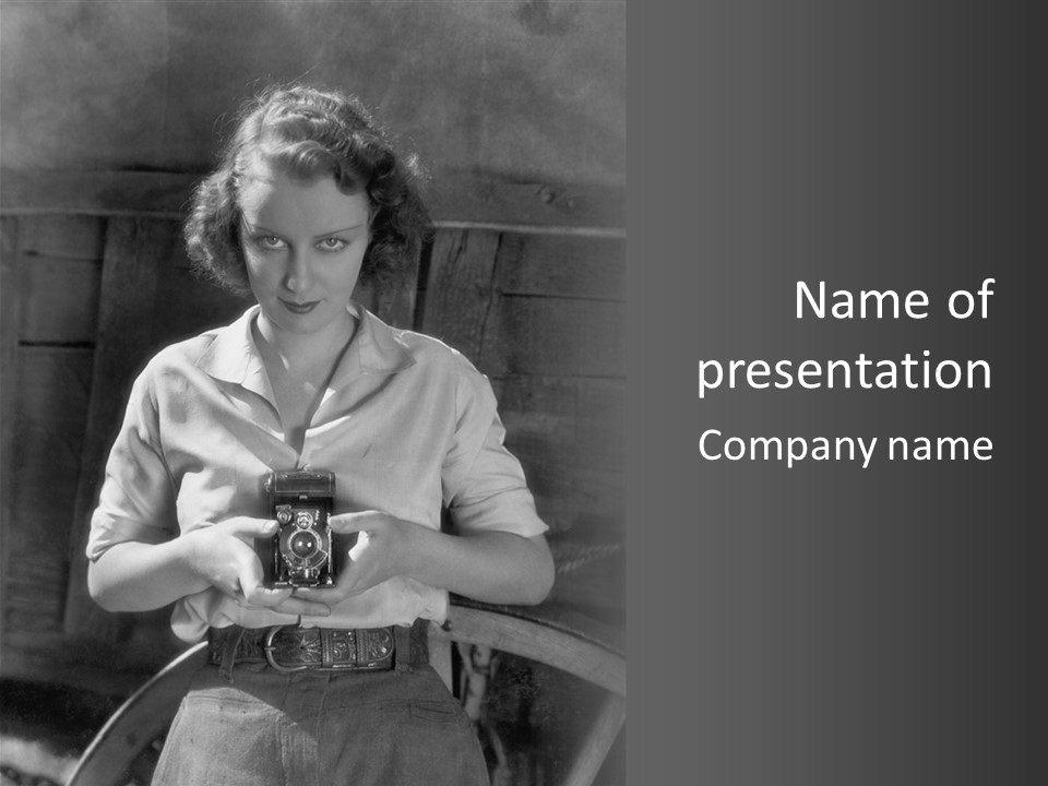 A Black And White Photo Of A Woman Holding A Camera PowerPoint Template