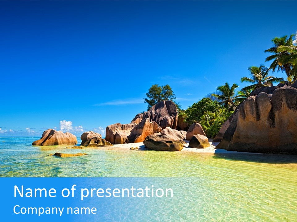 A Tropical Beach With Palm Trees And Rocks In The Water PowerPoint Template