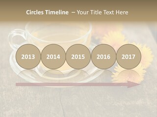 A Cup Of Tea With Dandelions On A Wooden Table PowerPoint Template