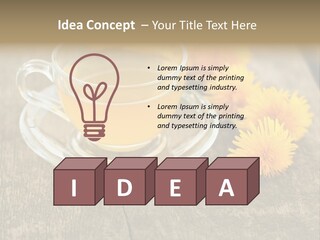 A Cup Of Tea With Dandelions On A Wooden Table PowerPoint Template