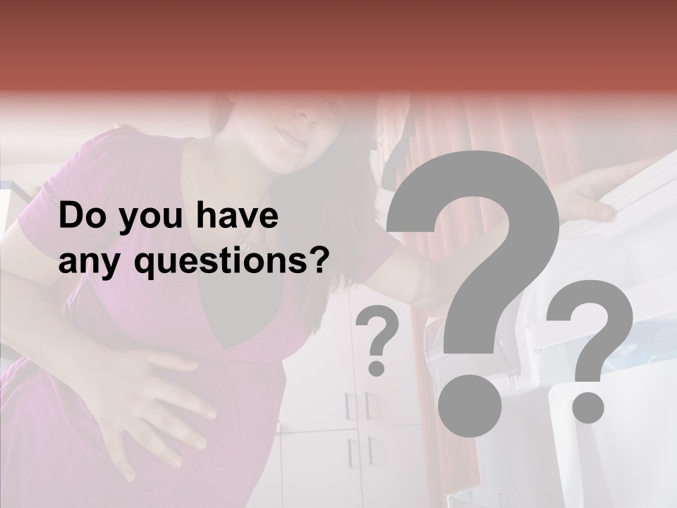 A Woman Standing Next To A Refrigerator In A Kitchen PowerPoint Template