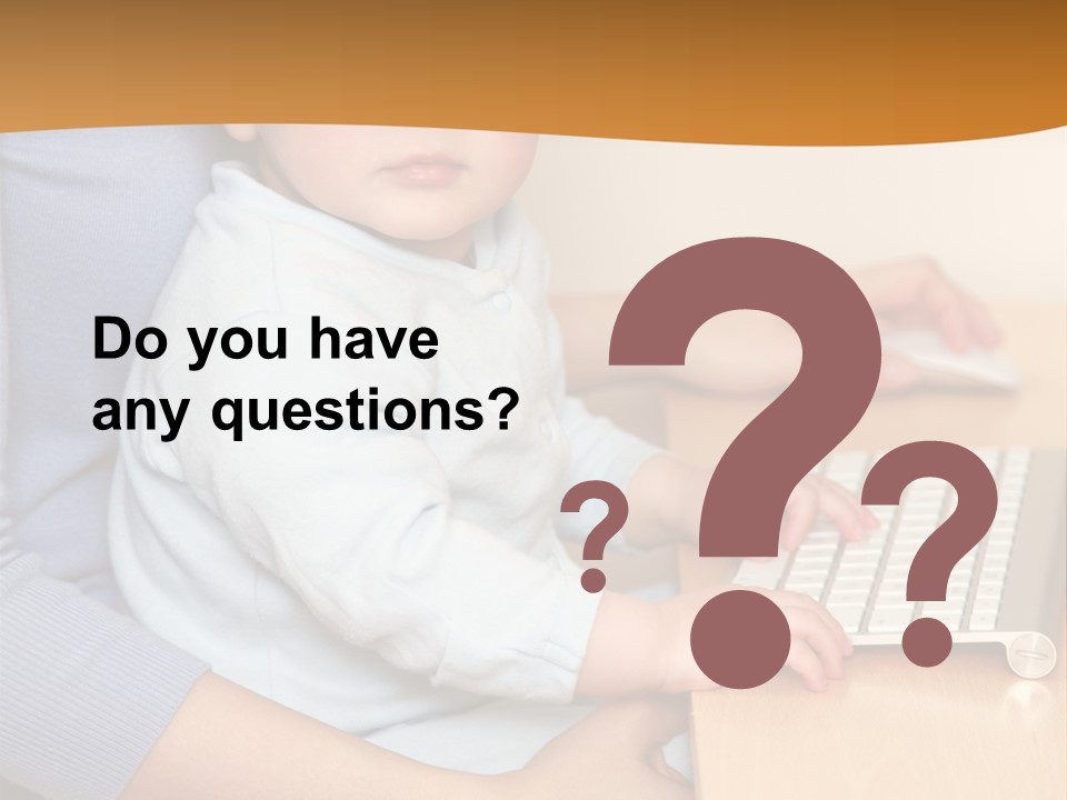 A Woman Holding A Baby Using A Laptop Computer PowerPoint Template