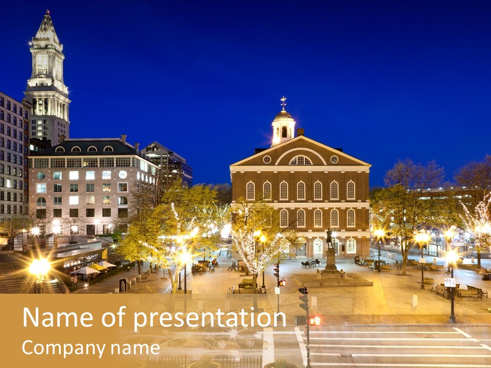 A Town Square With A Clock Tower At Night PowerPoint Template