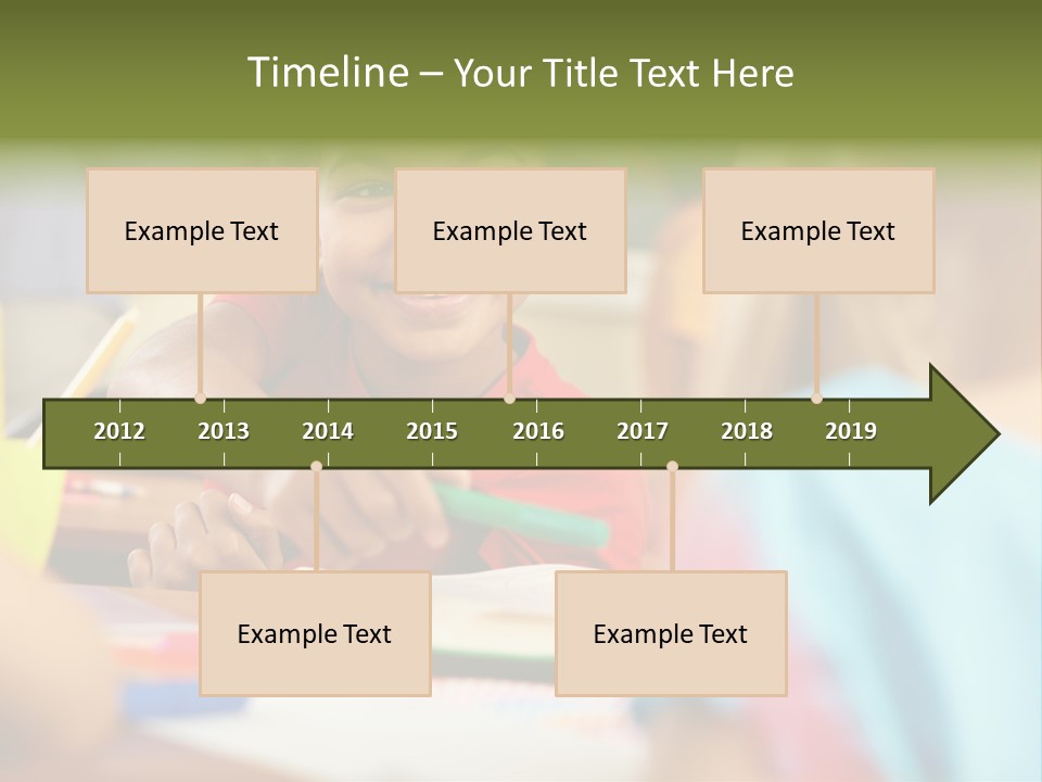 A Young Girl Smiles As She Sits At A Desk PowerPoint Template