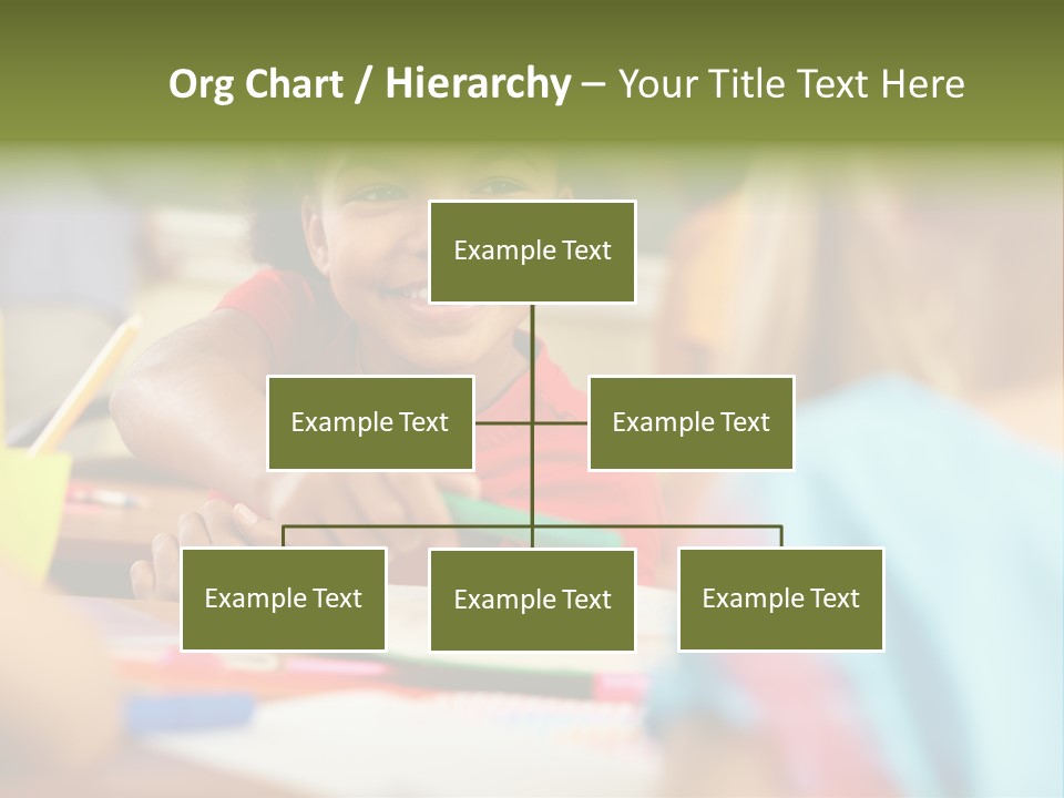 A Young Girl Smiles As She Sits At A Desk PowerPoint Template