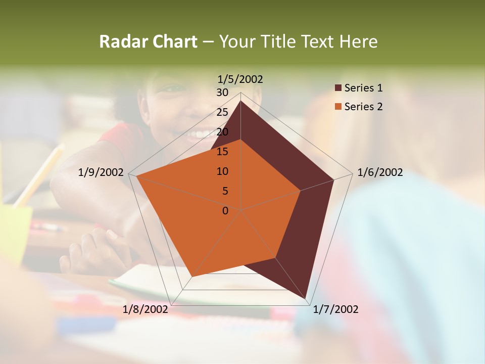 A Young Girl Smiles As She Sits At A Desk PowerPoint Template
