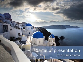 A Blue And White Church On A Cliff Overlooking The Ocean PowerPoint Template