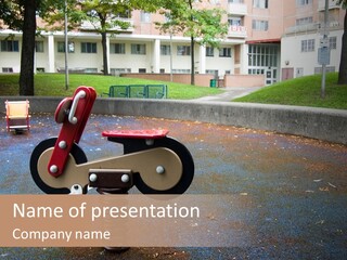 A Child's Play Area With A Red And Black Toy Bike PowerPoint Template
