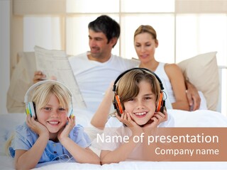 A Couple Of Kids Laying On Top Of A Bed PowerPoint Template