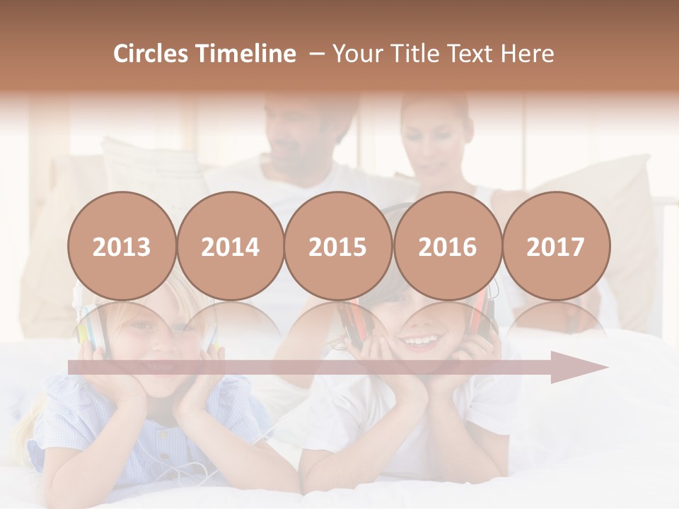 A Couple Of Kids Laying On Top Of A Bed PowerPoint Template