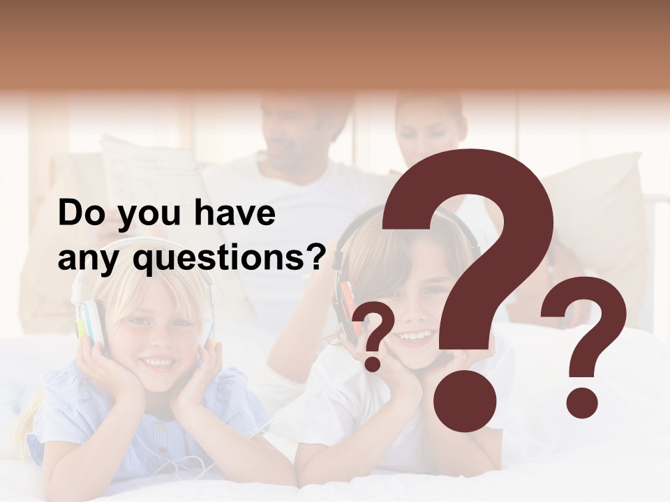 A Couple Of Kids Laying On Top Of A Bed PowerPoint Template