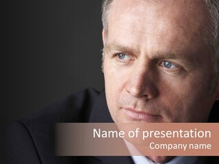 A Man In A Suit And Tie Is Looking At The Camera PowerPoint Template