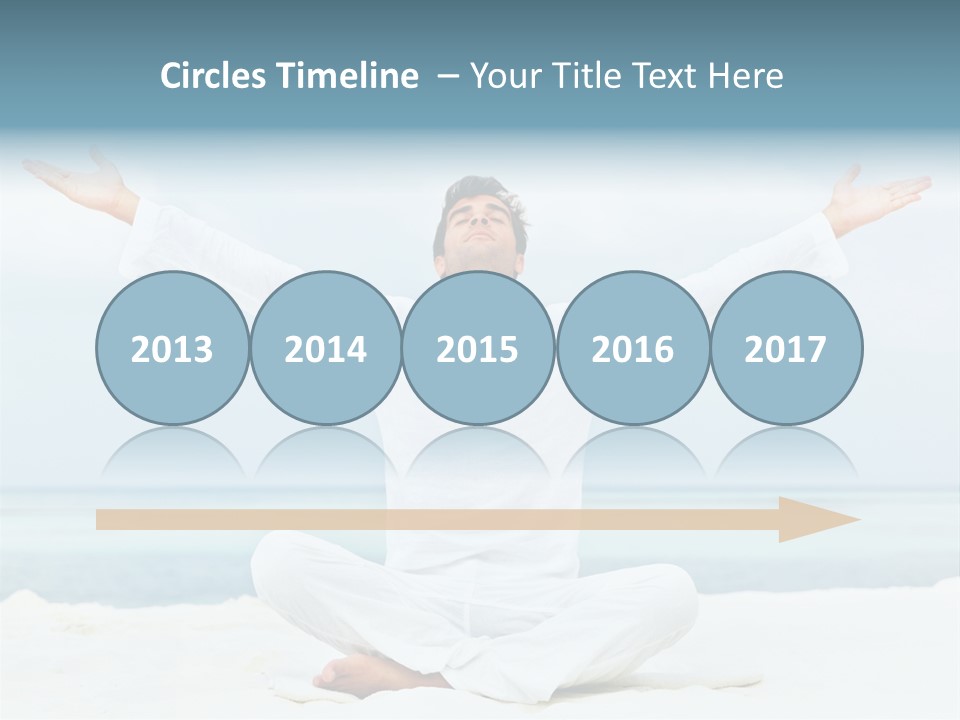 A Man Sitting In A Yoga Pose On The Beach PowerPoint Template