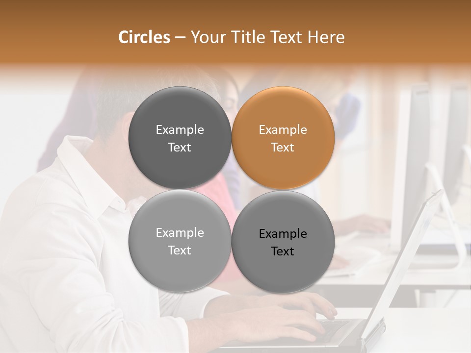 A Group Of People Sitting At A Table With Computers PowerPoint Template